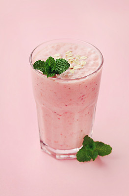 Healthy strawberry milkshake, yogurt or smoothie with oatmeal, vegan superfood
