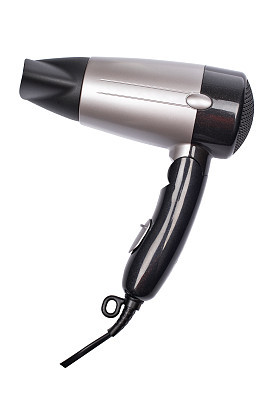 Black and silver hair dryer isolated on a white background