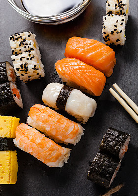Slate tray of assorted sushi