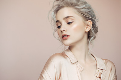 Beautiful woman with make-up and stylish hairstyle