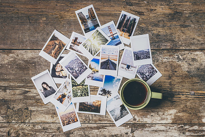 Instant camera prints on a table