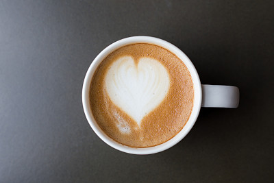 coffee cup latte art on table. top view