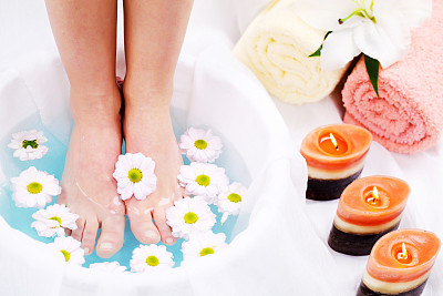 Spa treatment.  Legs in blue water