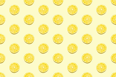 Lemon slices seamless pattern on pastel yellow background Minimal summer concept.