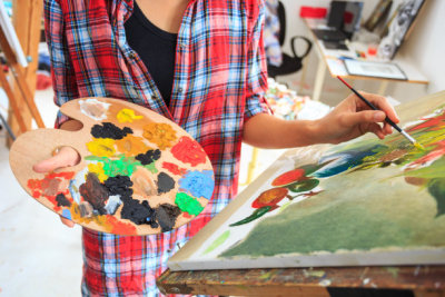 Young woman drawing in art studio