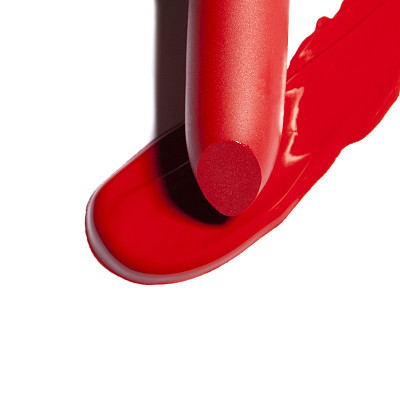 Dark red lipstick on white background.