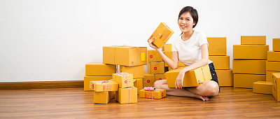 Banner and Web Design Picture Ratio Start up small business entrepreneur SME or freelance woman working with box at home office online marketing packaging box and delivery, SME and delivery concept