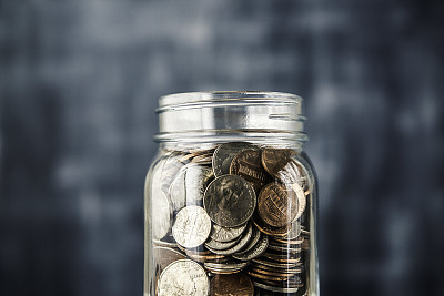 Savings jar filled with coins
