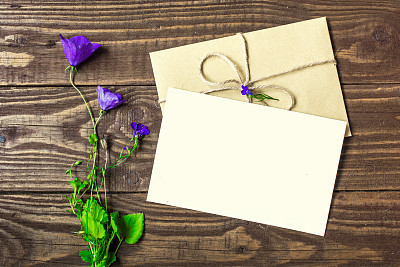 bouquet of purple wildflowers with blank white greeting card