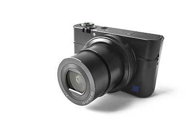 Modern compact camera on white