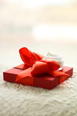 Luxury face cream jar and red gift box