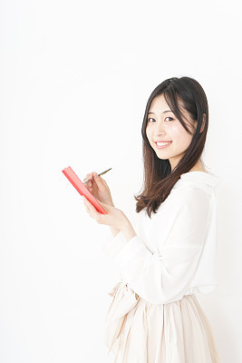 Young woman taking a note