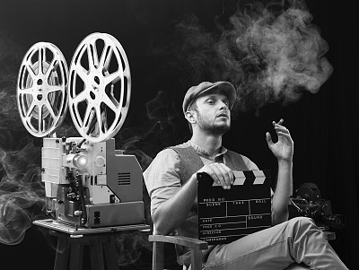 Film director watching his movie for editing