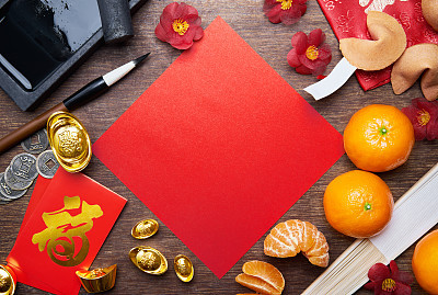 Chinese new year decorations with a blank red paper as copy space