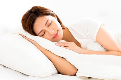 young beautiful woman sleeping in the bed
