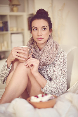 young brunette woman in home interior.