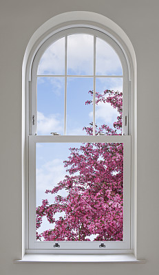arched window and cherry blossoms