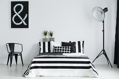 Bedroom with chair and lamp