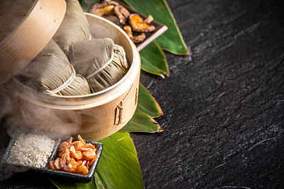 Zongzi, delicious fresh hot steamed rice dumplings in steamer. Close up, copy space, famous asian tasty food in dragon boat duanwu festival