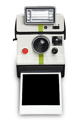 An instant camera with a flash developing film