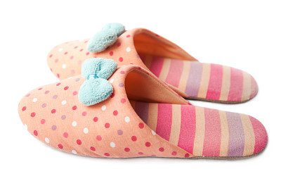 Cute funny pink striped dotted girl clown slippers isolated