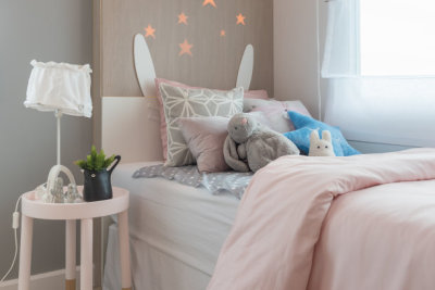 kid's bedroom with colorful pillows