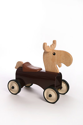 Brown deer toy on wheels
