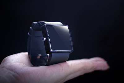 Hand with smartwatch.