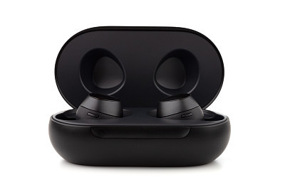 Wireless headphones on a white background. Headset close up in the charging case close-up.