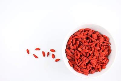 dried goji berries in a small white bowl