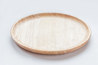 Close up empty flat wooden dish isolated on white background