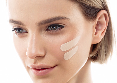 Perfect makeup. Skin tone cream lines on woman face.