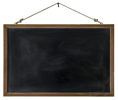 An old wooden framed blackboard hangs from a rusty nail, isolated on white, clipping path included.