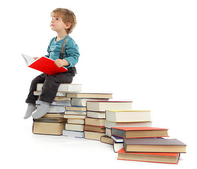 Cute baby Boy sitting on a Book Staircase