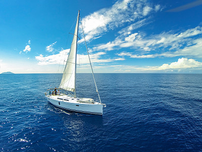 Sailing crew on sailboat