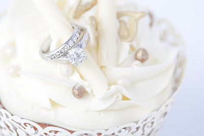 Engagement ring in wedding cupcake