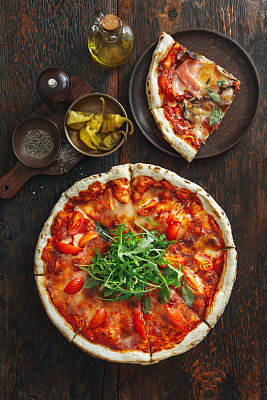 Vegetarian pizza with tomato sauce and arugula