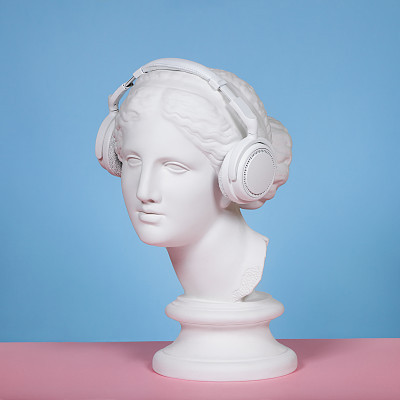Female plaster head with headphones