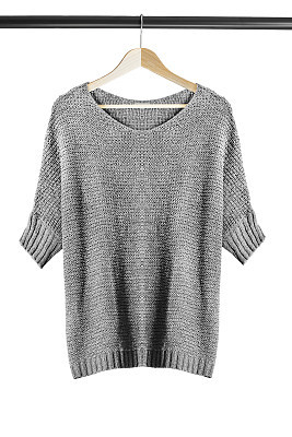Sweater on clothes rack