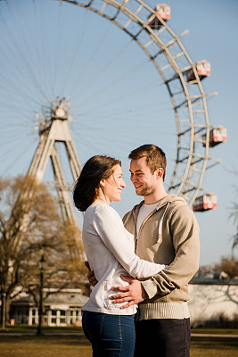 Young couple dating in amusement park