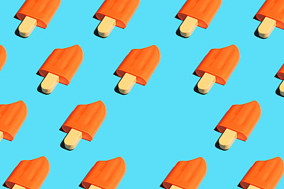 Colorful ice cream popsicle pattern on bright blue background.