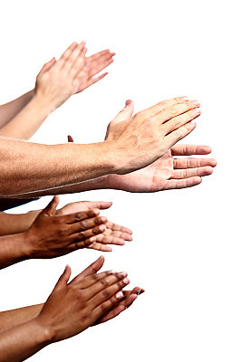 Many mixed hands clapping enthusiastically