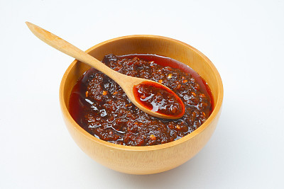 close up of a bowl of red chili paste
