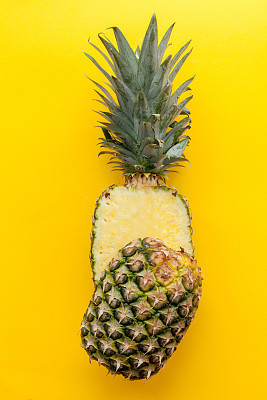 Pineapple on a solid yellow background