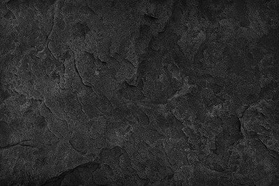 Black Stone background. Dark gray texture close up high quality May be used blank for design. Copy space