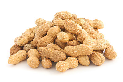 A large pile of peanuts still in their shell