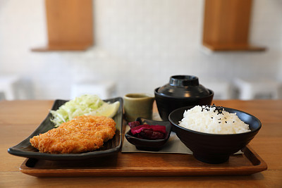 Tonkatsu fried pork cutlet with rice and soup on wooden table Japanese food
