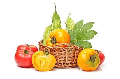 Home grown  tomatoes and   Balsam pear  on white background