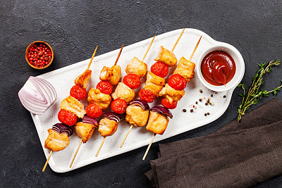Chicken kebab or shashlik with vegetables