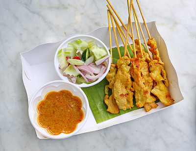 Pork satay, Grilled pork served with peanut sauce.